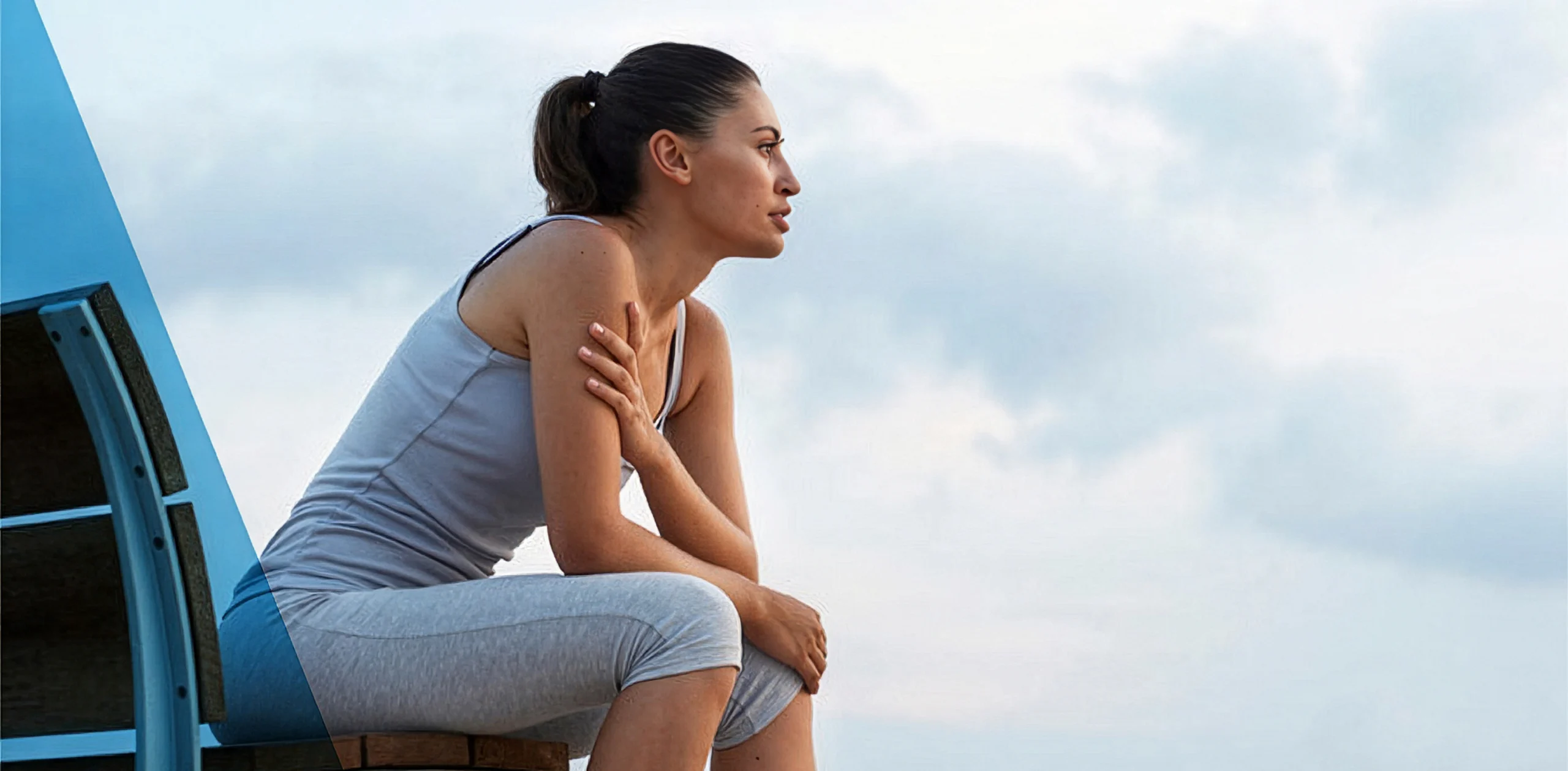 Woman staring out at the ocean